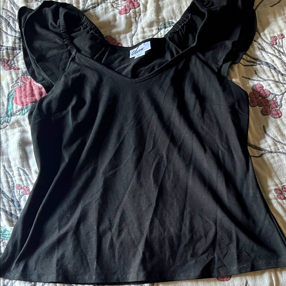 Vixen NWOT shirt. Tried on popped the tags  and changed my mind.